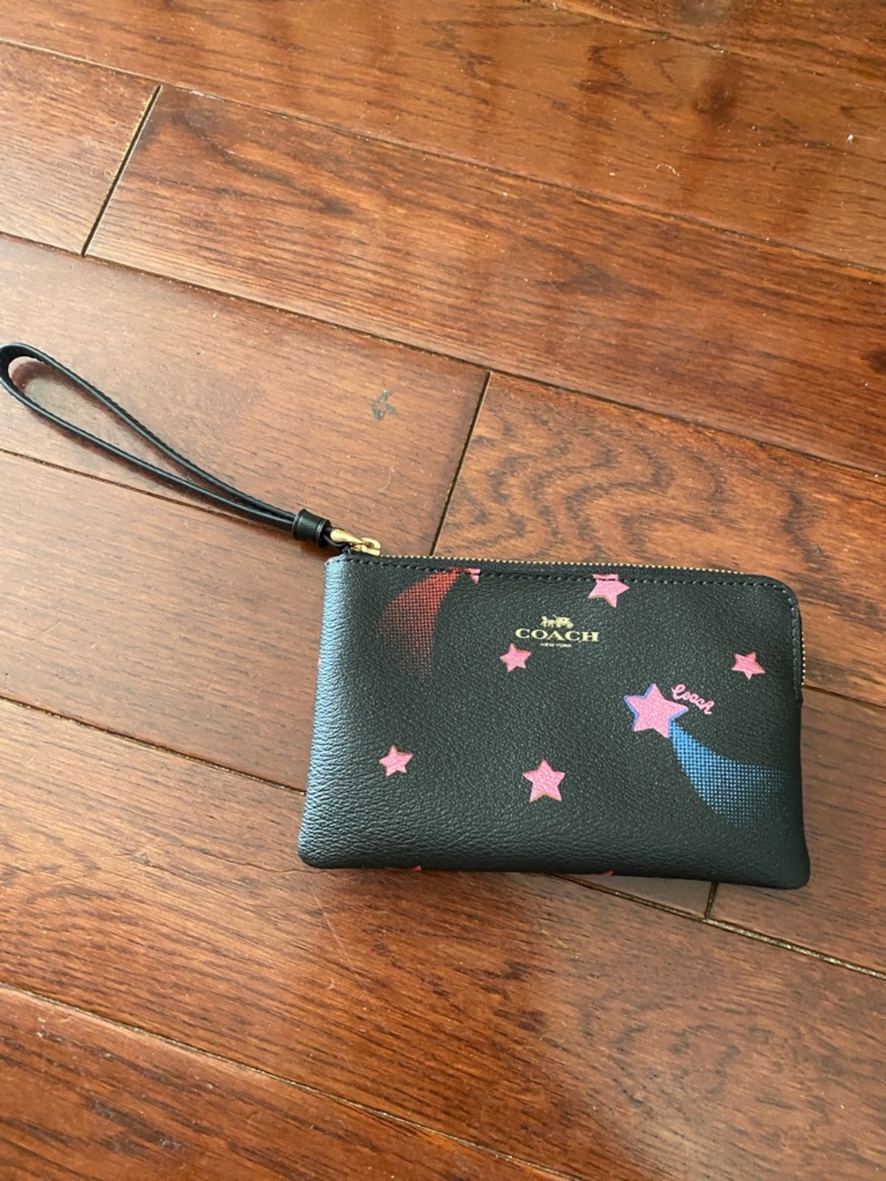 Coach Black Pebbled Leather Star Print Wristlet with Pink and Blue Accents